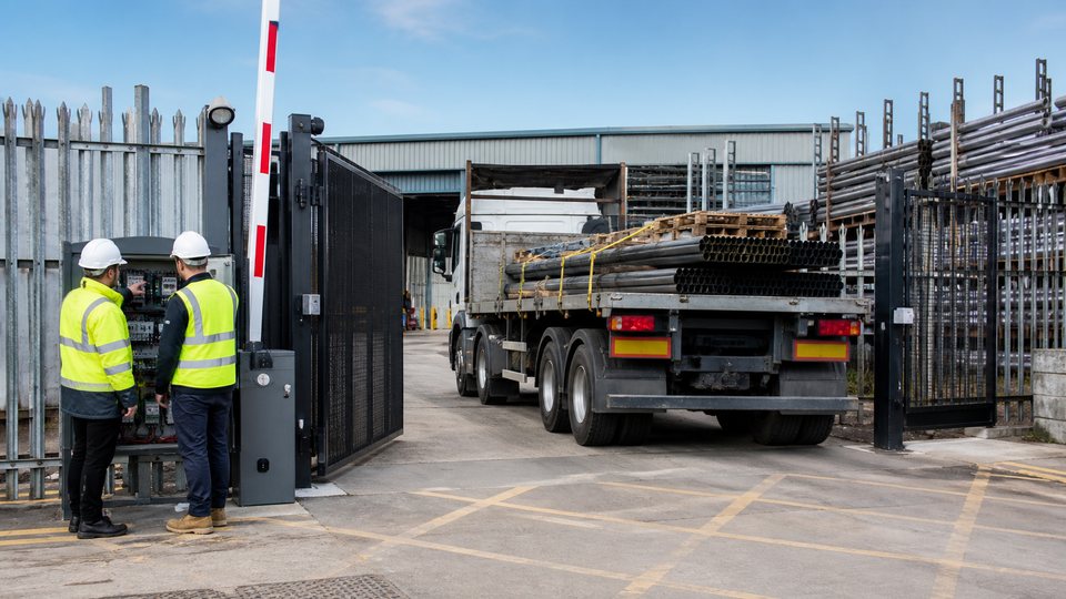 Automated gate and barrier at an engineering site entrance with heavy vehicle access